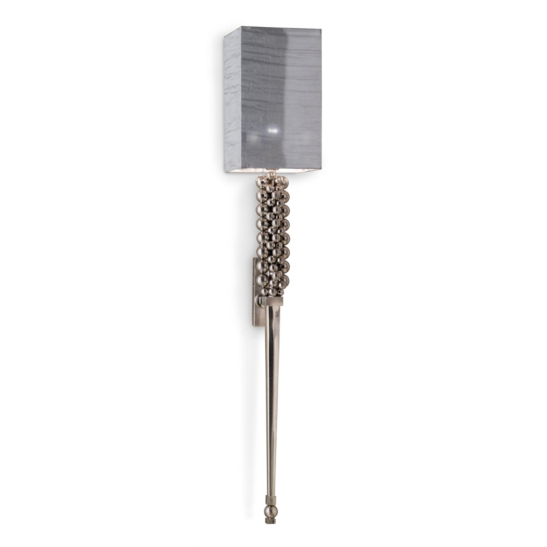 Hand forged iron and brass wall lamp, with brushed, chromed finish.
Double “lux” silk lampshade over silver foil.