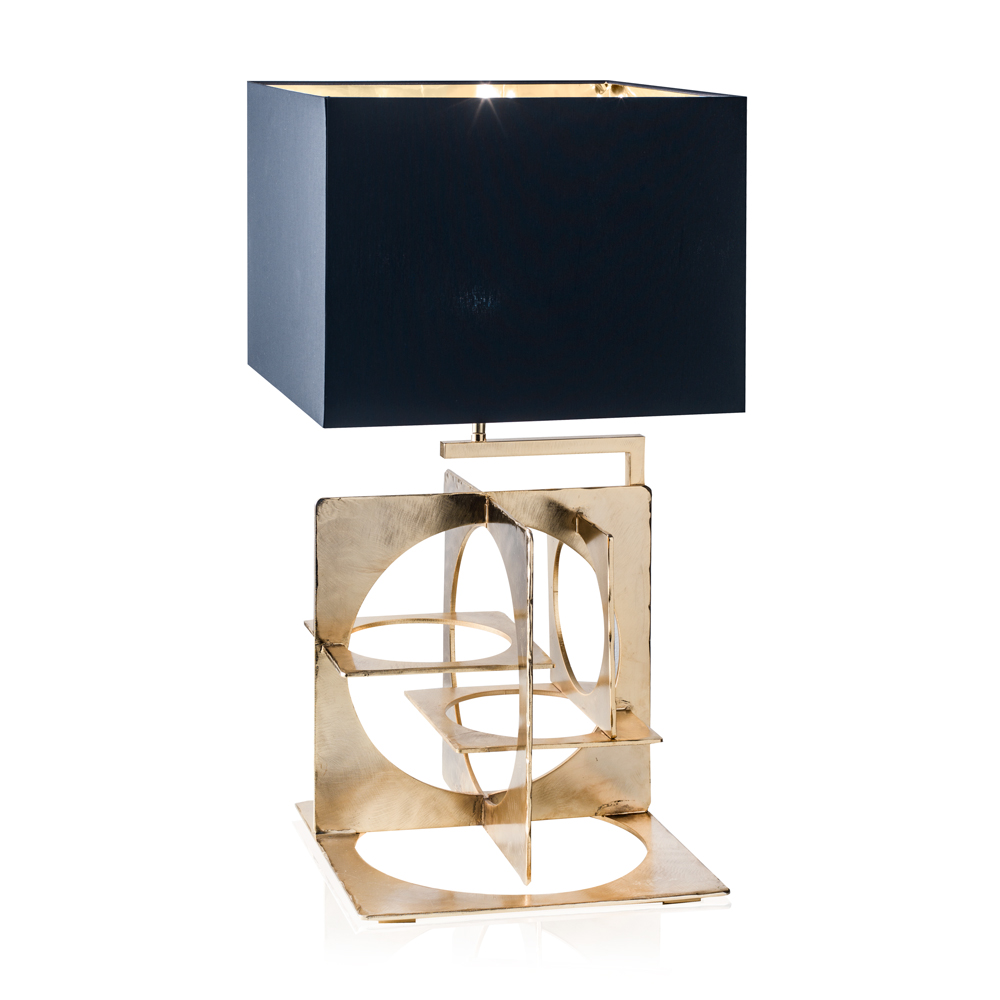 Table lamp in hand emery and engraved steel, aged gold finish. Black
chintz lampshade with golden inside.